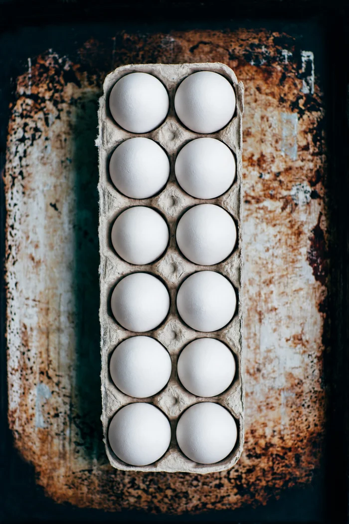 White eggs in a paper carton
